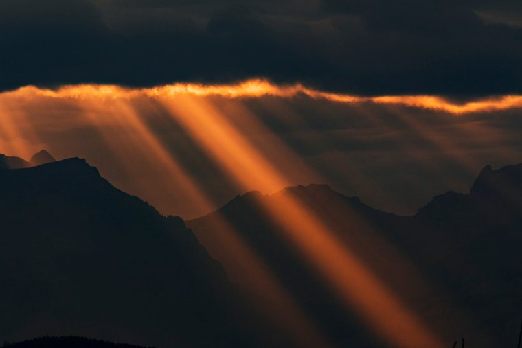 Sun rays over mountain ridges