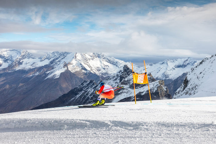 Livio Hiltbrand passing a gate with the summit behind