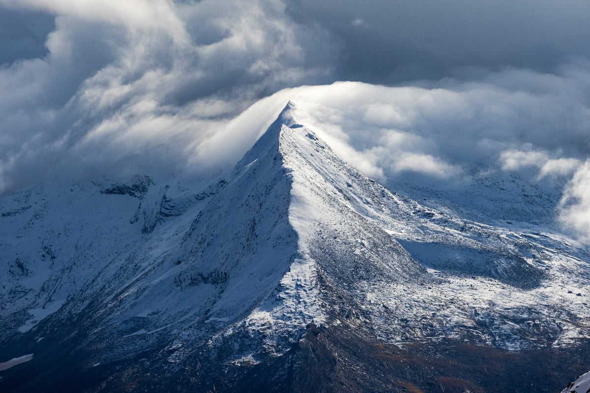 Cloud-covered peak above the Saas-Fee glacier