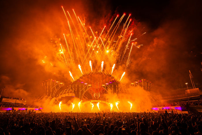 Main stage in orange smoke with fire fountains and fireworks