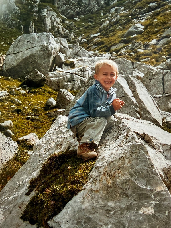 Lucas as a kid in the mountains