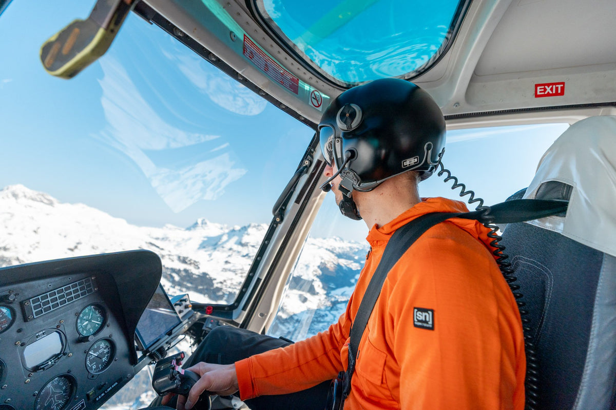 Helicopter pilot flying above the Arlberg peaks