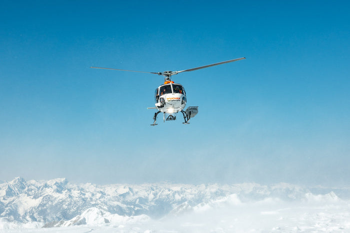 Helicopter approaching the landing spot high above Zürs