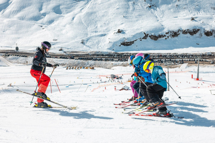Ski instructor teaching a group of children on the Zürs practice slope