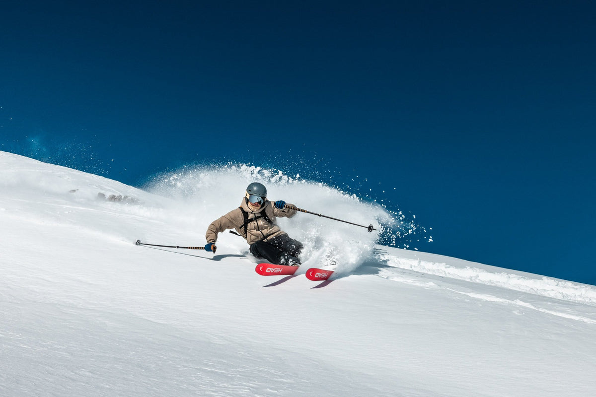 Powder turn under a deep blue sky
