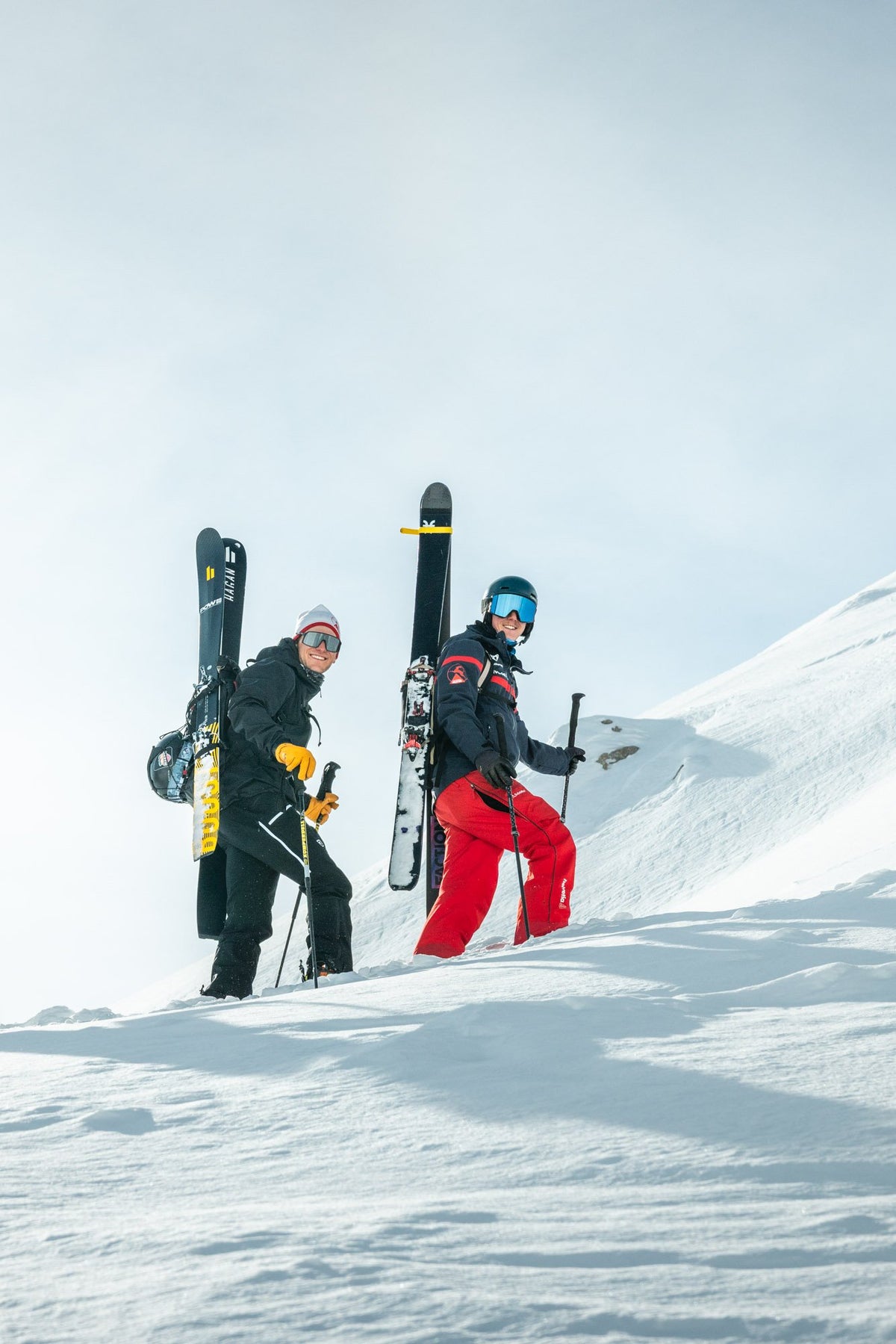 Ski touring ascent with skis on the backpack