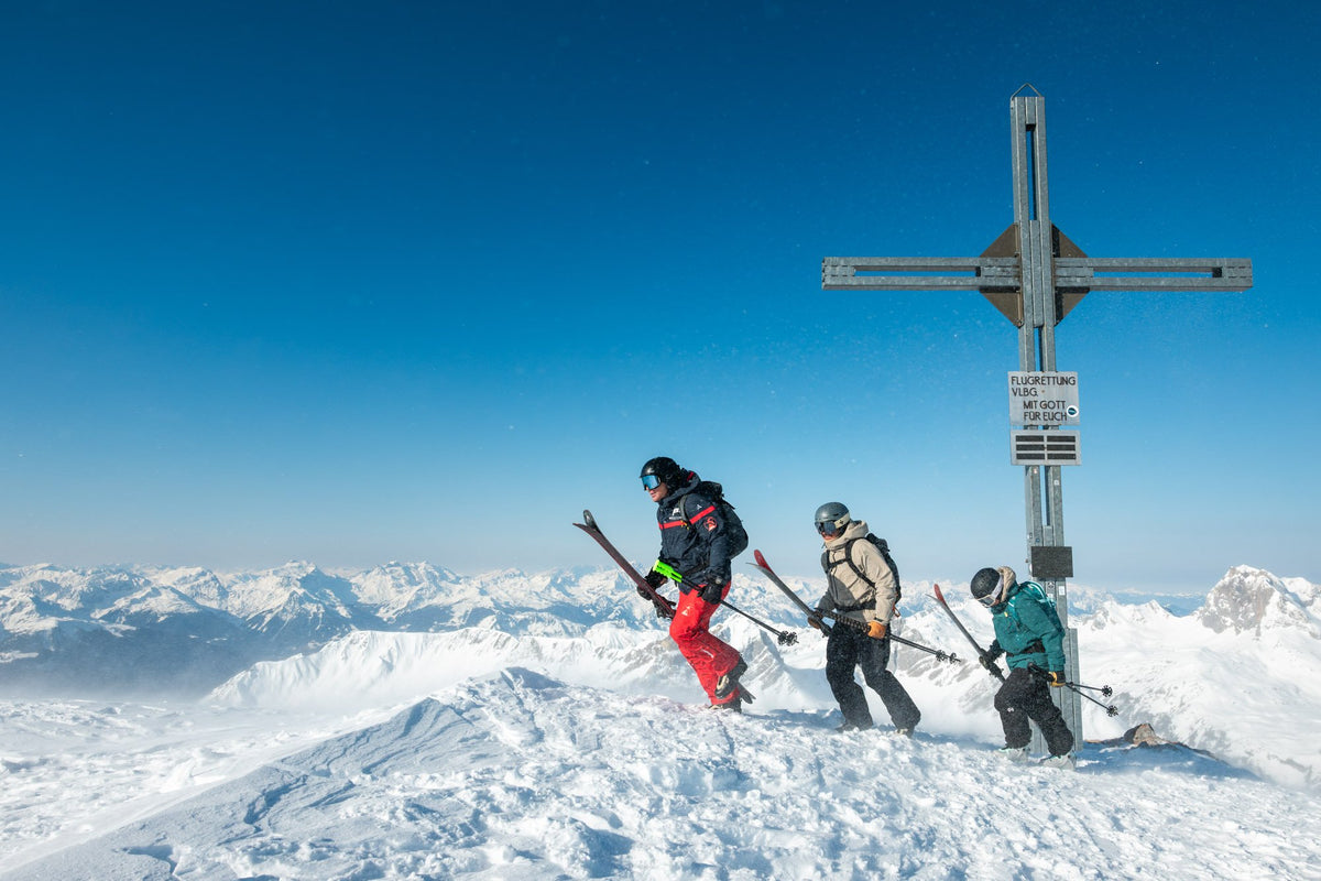 Ski touring group at the summit cross