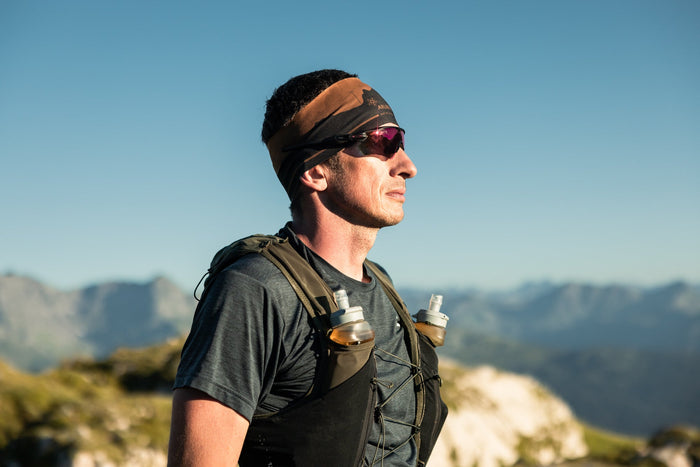 Profile portrait of a trail runner in warm morning light